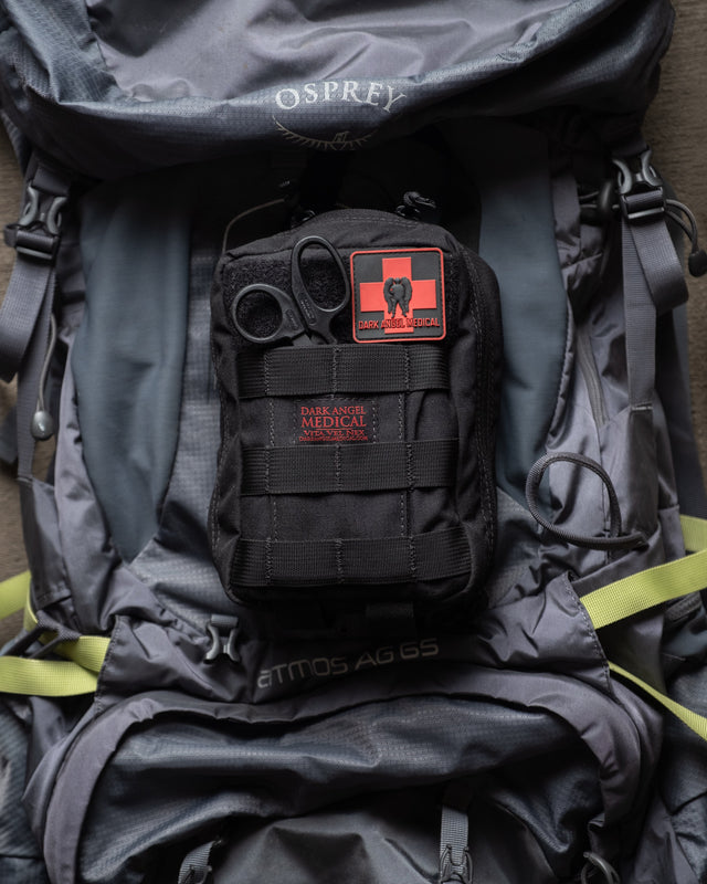 D.A.R.K. Explorer Kit mounted on a hiking backpack