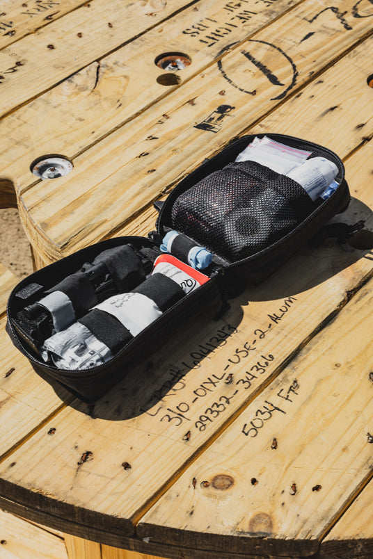 D.A.R.K. Explorer Kit open showing trauma and first aid sides with shears