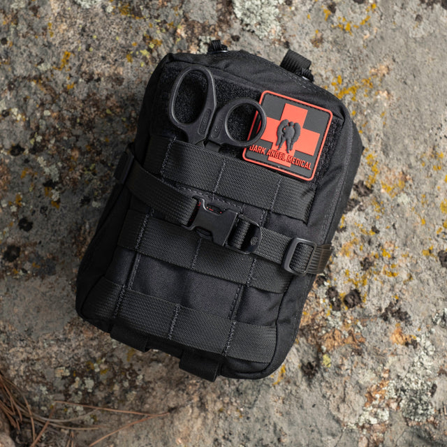 Black D.A.R.K. Explorer Kit on a rock outdoors