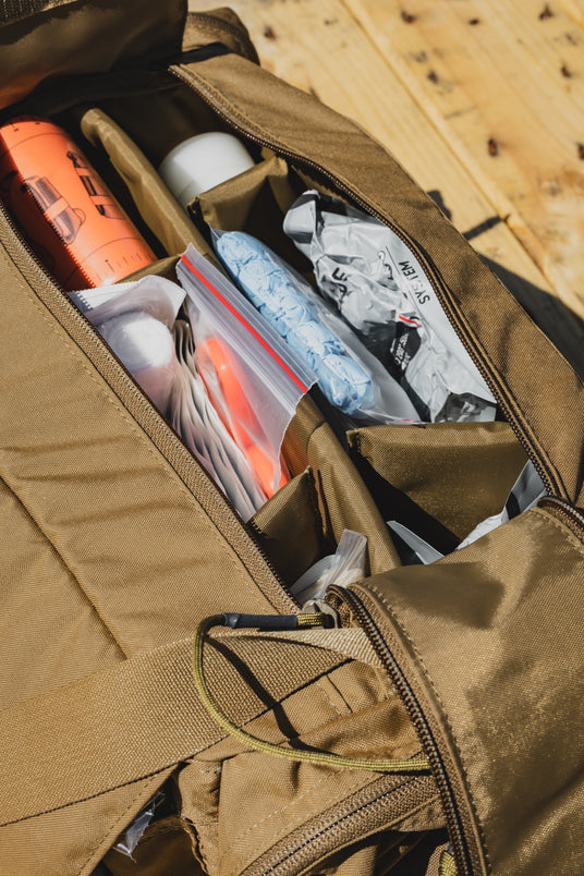 ST MIKE Bag main compartment open showing organized trauma and first aid supplies in dividers