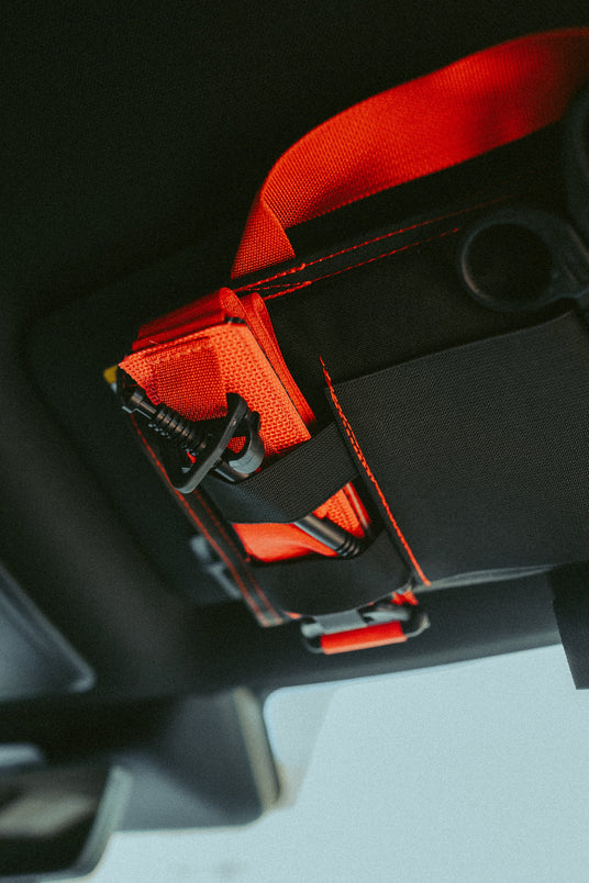 Red grab handle on the VISR visor trauma kit ready for instant deployment