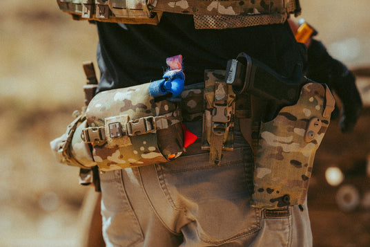 Multicam trauma kit and tourniquet carried on a belt at the range