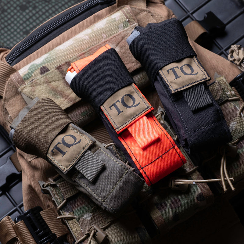 D.A.R.K. Trauma Kit and Tourniquet Holders mounted on a Multicam plate carrier