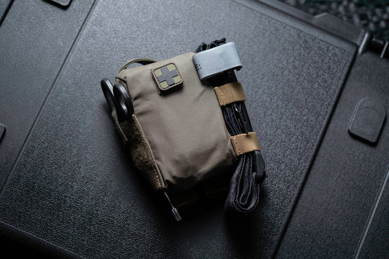 Compact EDC Trauma Kit standing on a hard case