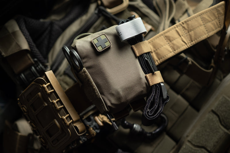 EDC Trauma Kit mounted to a plate carrier with MALICE Clips