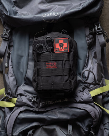 D.A.R.K. Explorer Kit mounted on a hiking backpack