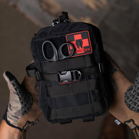D.A.R.K. Explorer Kit held in a gloved hand