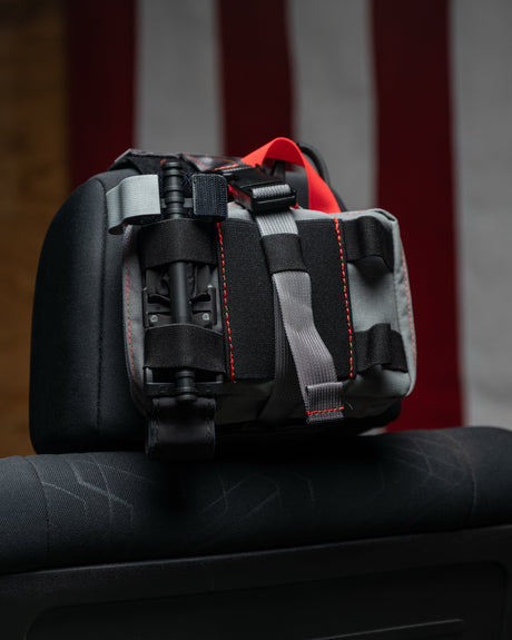 Wolf grey HEDR headrest trauma kit with an American flag backdrop