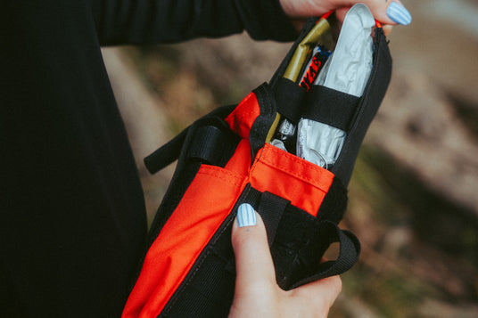Pulling the vacuum sealed insert from a D.A.R.K. Trauma Kit