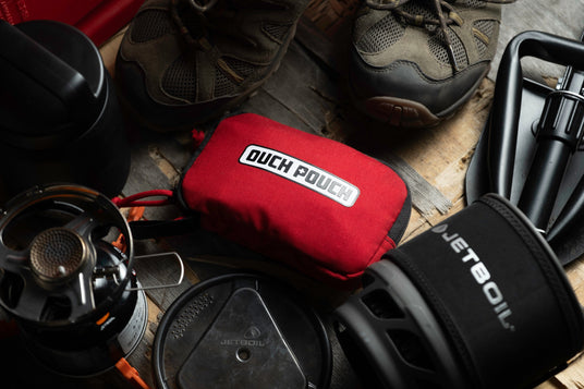 Ouch Pouch first aid kit with camp stove and hiking gear