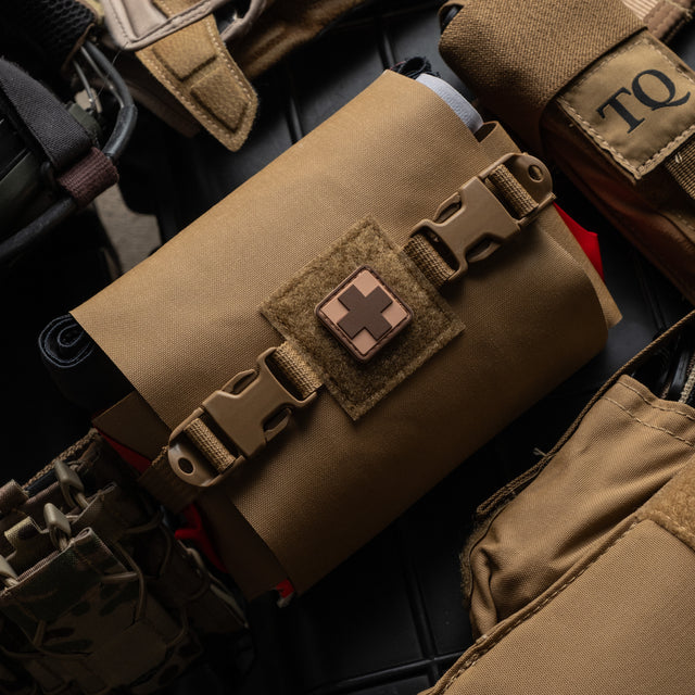 Coyote brown S.P.E.A.R. trauma kit on duty gear