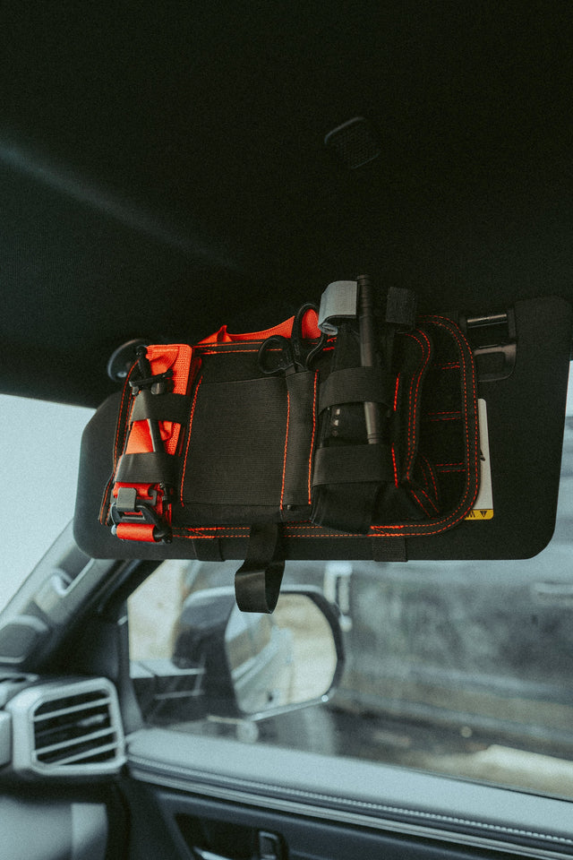VISR trauma kit attached to a flipped-down vehicle visor